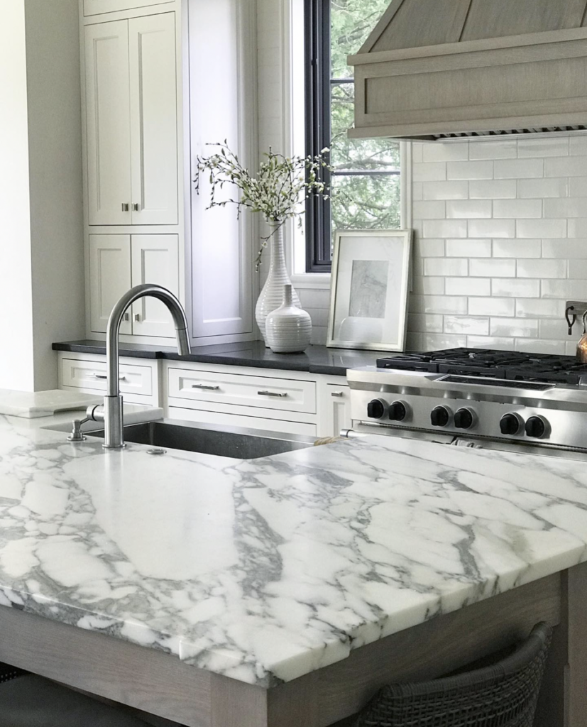 White Cabinets Black Countertop and Silver Faucet