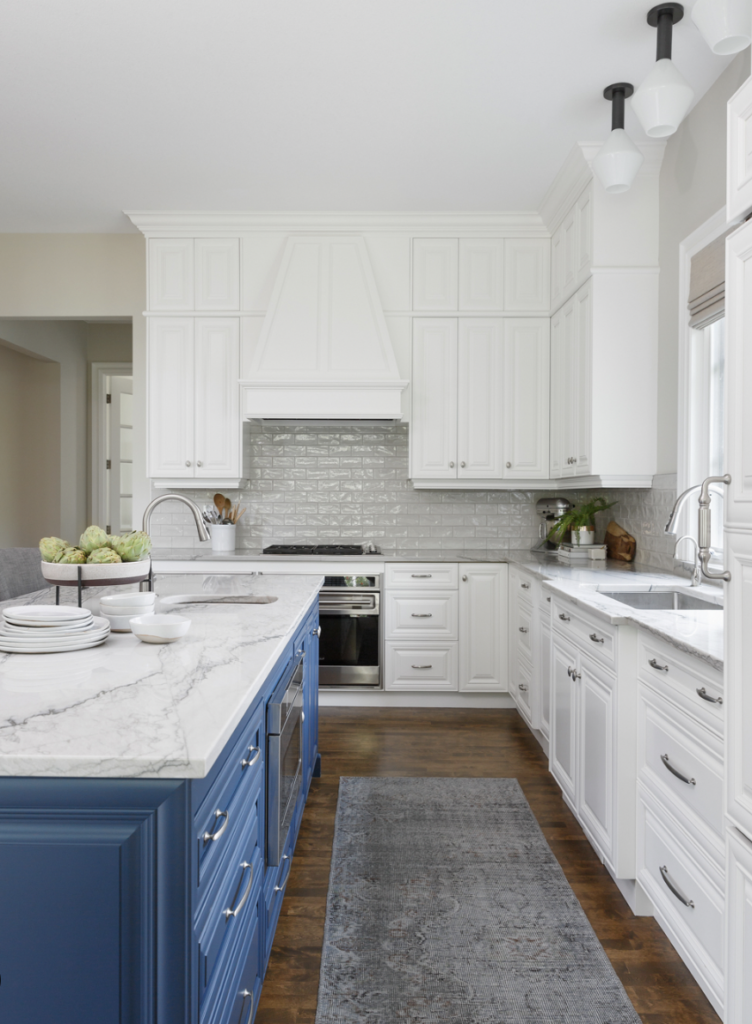 White Cabinets with Blue Island and Marble Countertop