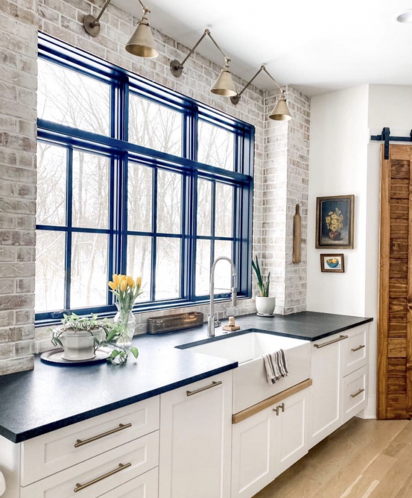 White Cabinets with Brick Backsplash
