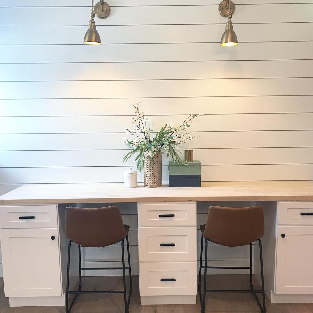 White Desks with Built-In Construction and Industrial Lighting