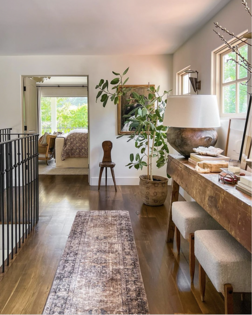 Farmhouse With White Walls And Wooden Flooring