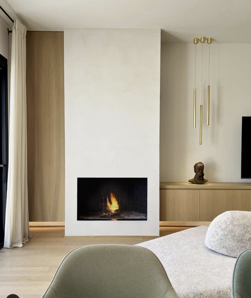 White Fireplace on a Wood-Accented Living Room Wall