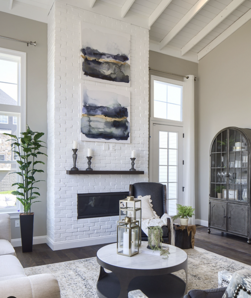 White Fireplace with Artwork in a Living Room