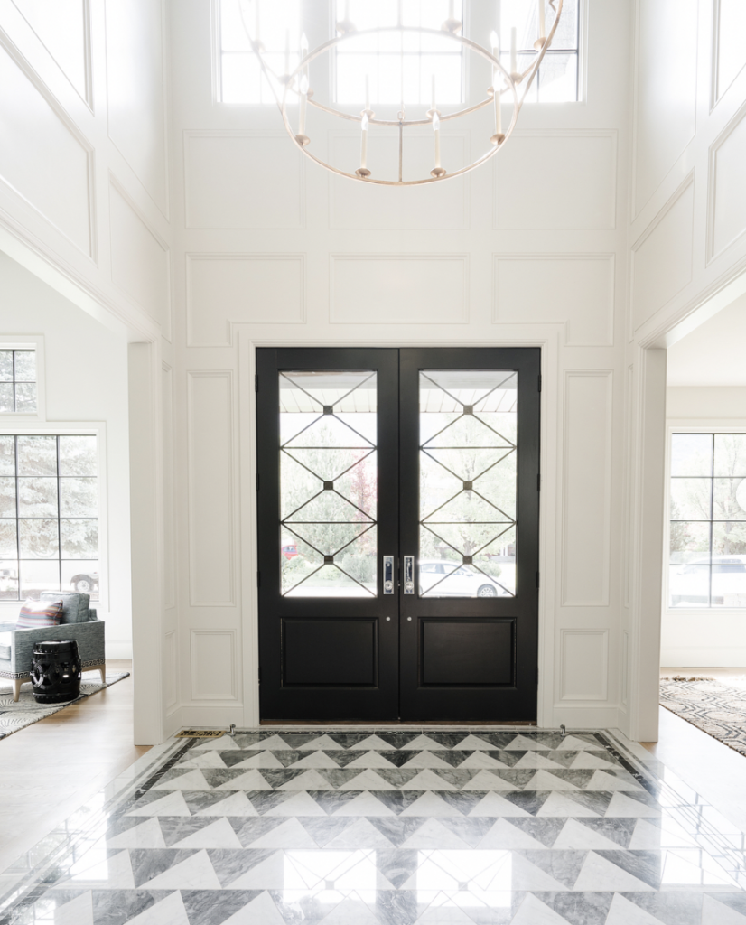 White Grey Flooring at a Black Door