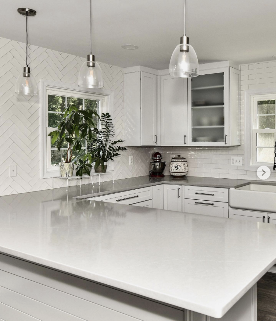 White Herringbone Pattern Backsplash With Gray Countertop