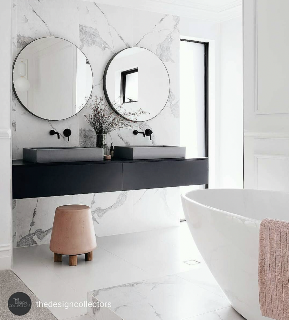 White Marble Wall with a Black Floating Vanity