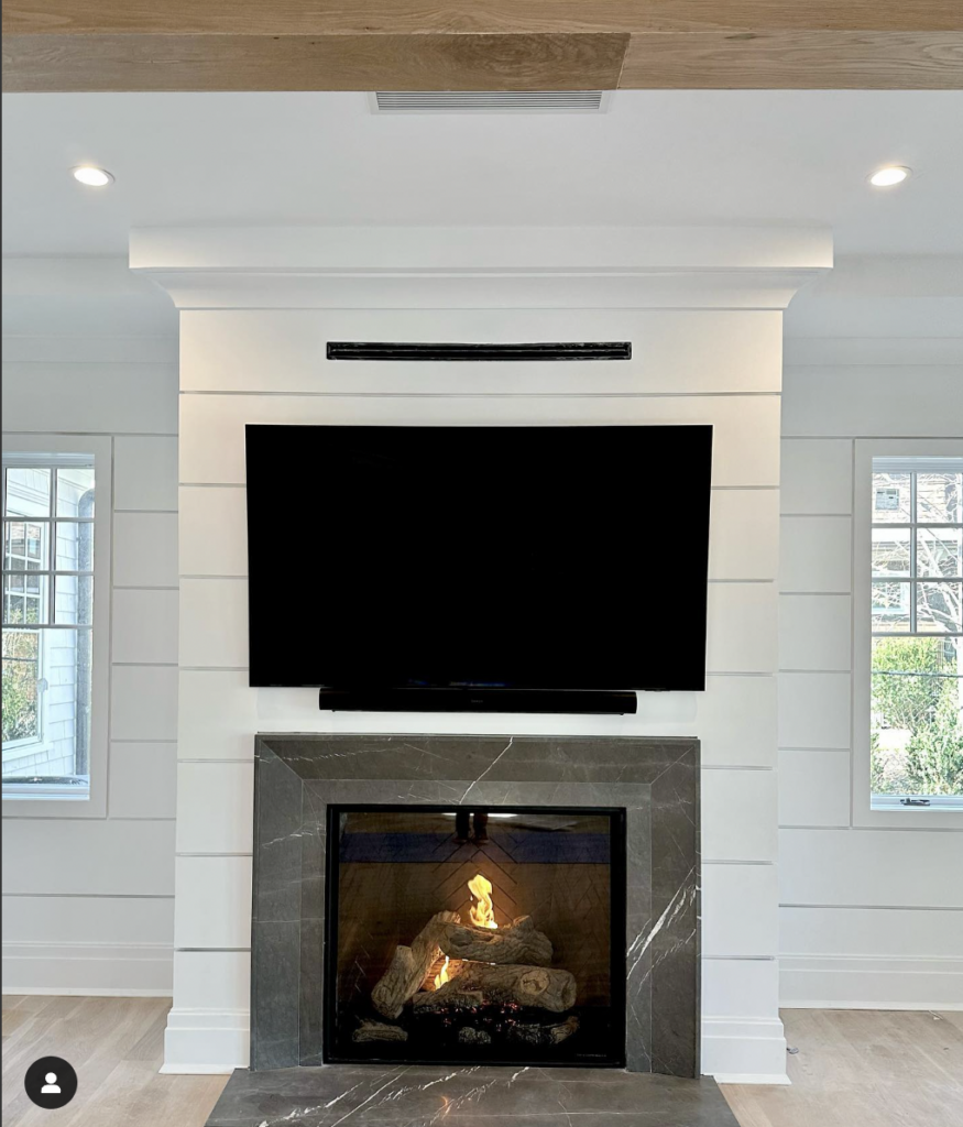 White Shiplap and Granite Around the Fireplace