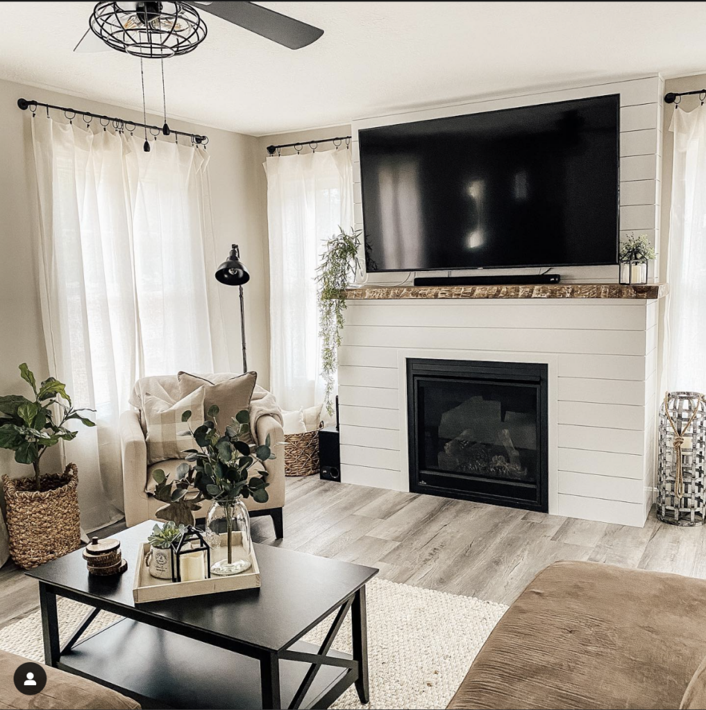White Shiplap Fireplace with a Wood Beam Mantel