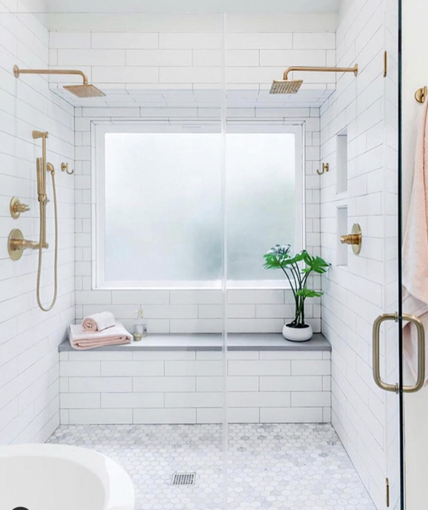 White Showers With Benches And Glass Door