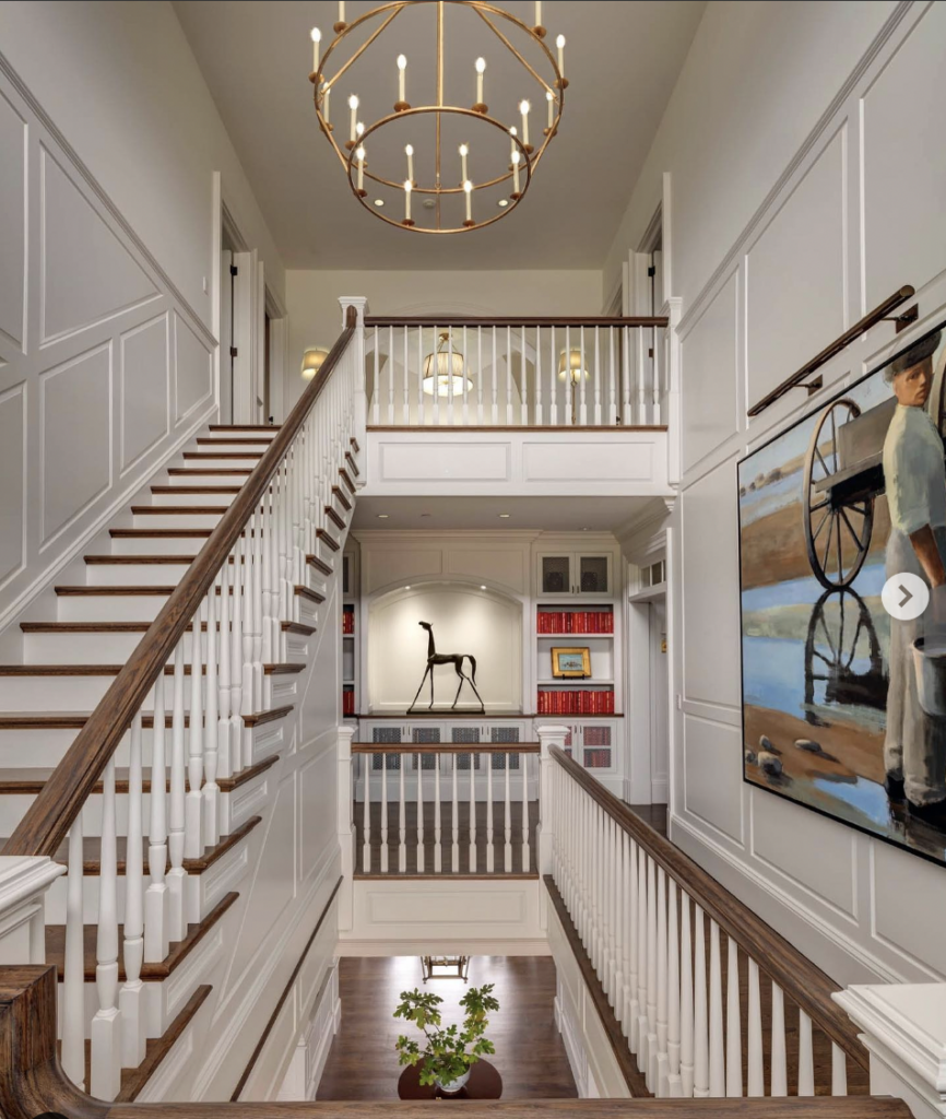 White Staircase Beside a Board and Batten Wall