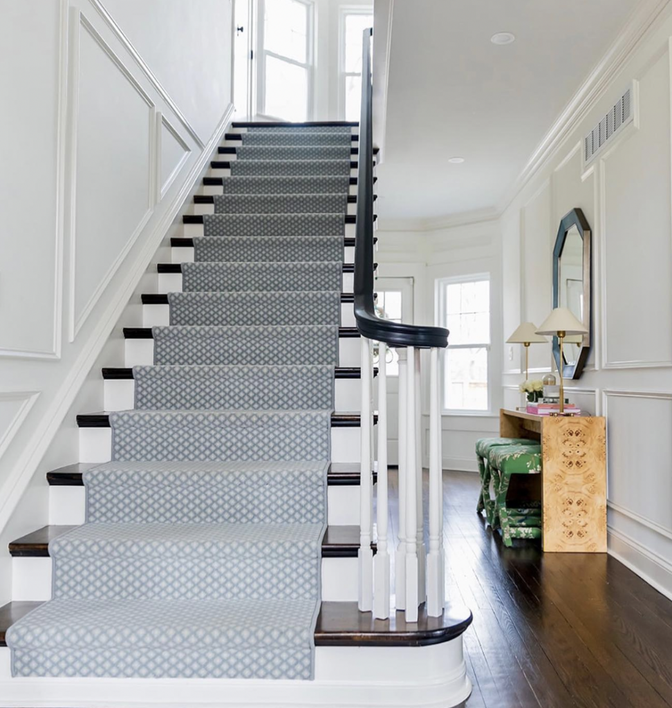 White Stairs with Blue Carpet and Decorative Molding