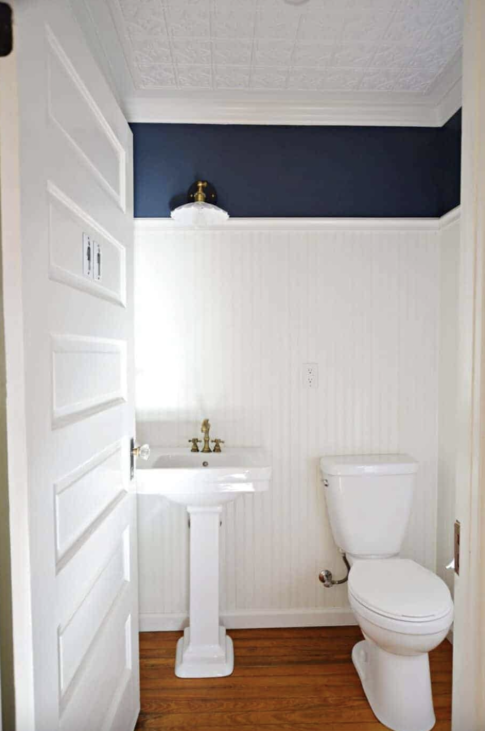 White Vinyl Beadboard Wainscoting Over a Navy Blue Wall