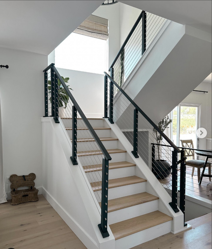 White Wood Stairs with a Black Banister