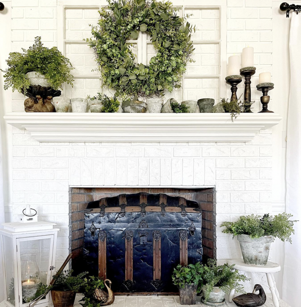 Wood mantel over the white fireplace