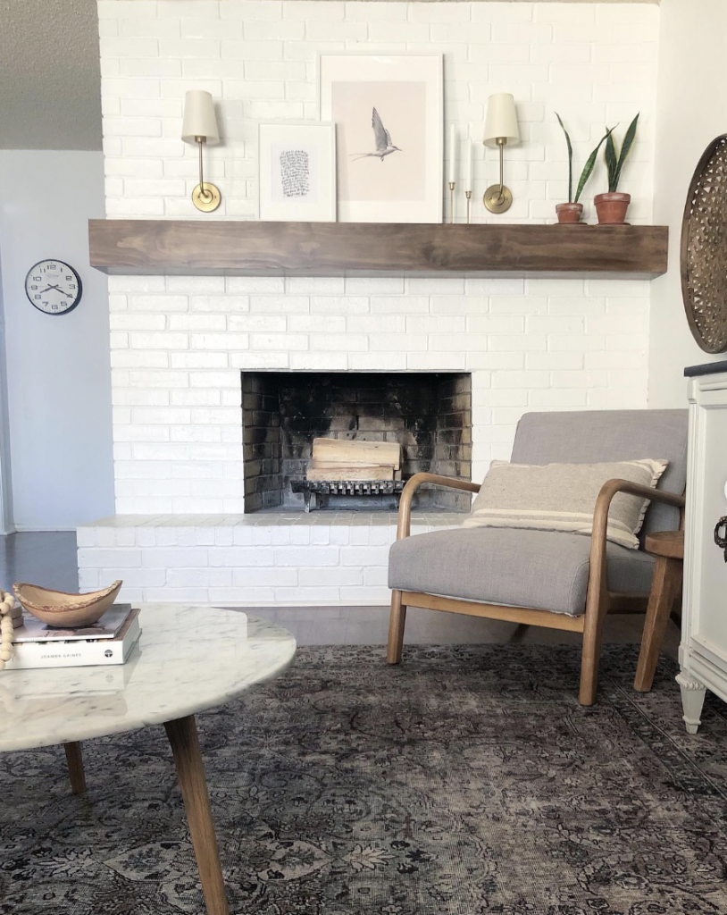 Wood Shelf with a Floating Style by a White Brick Fireplace