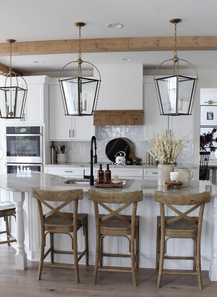 Wooden Beams, Bar Stools and Lighting Over the Kitchen Sink